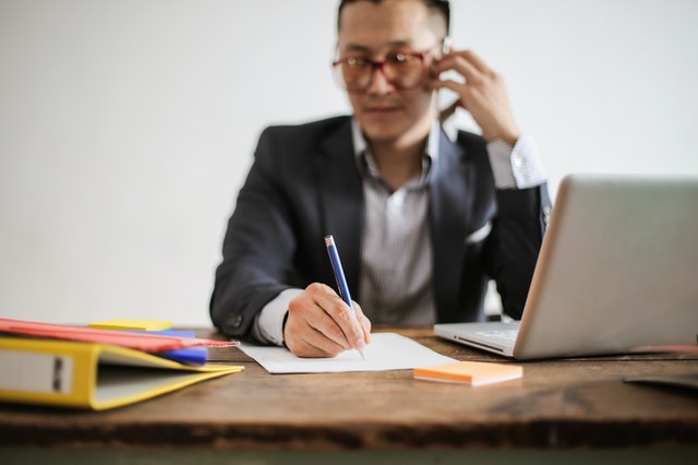 Man writing notes
